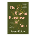 Book cover of 'They Bloom Because of You' by Jessica Urlichs with floral design and text.