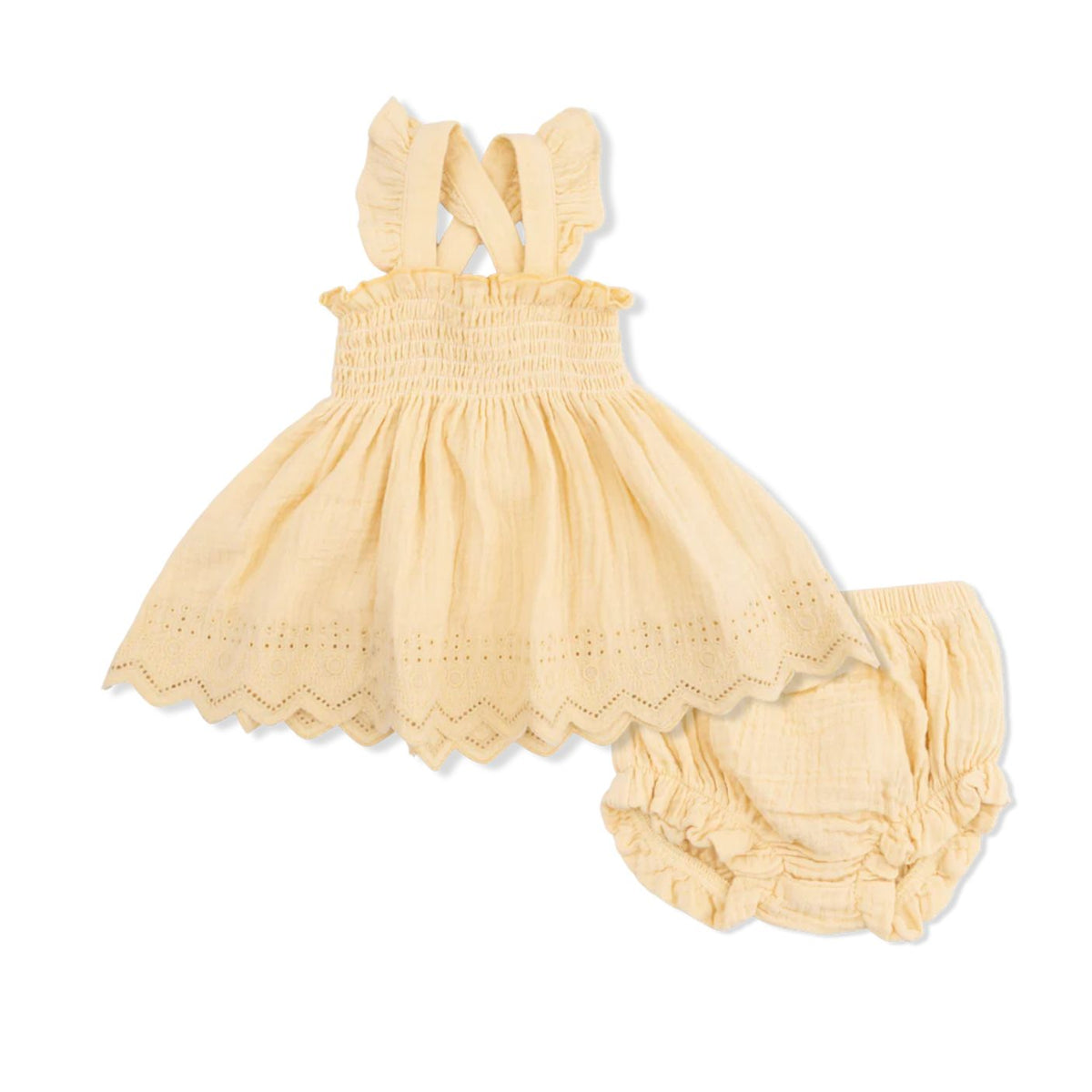 A baby girl's two-piece outfit set in pale yellow gauze, featuring a smocked dress with ruffled shoulder straps and eyelet trim, paired with matching ruffled bloomers, shown on a plain white background.