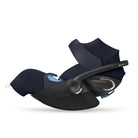 Black baby car seat with blue accents on a white background