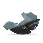 Baby car seat with black base and gray canopy on a white background