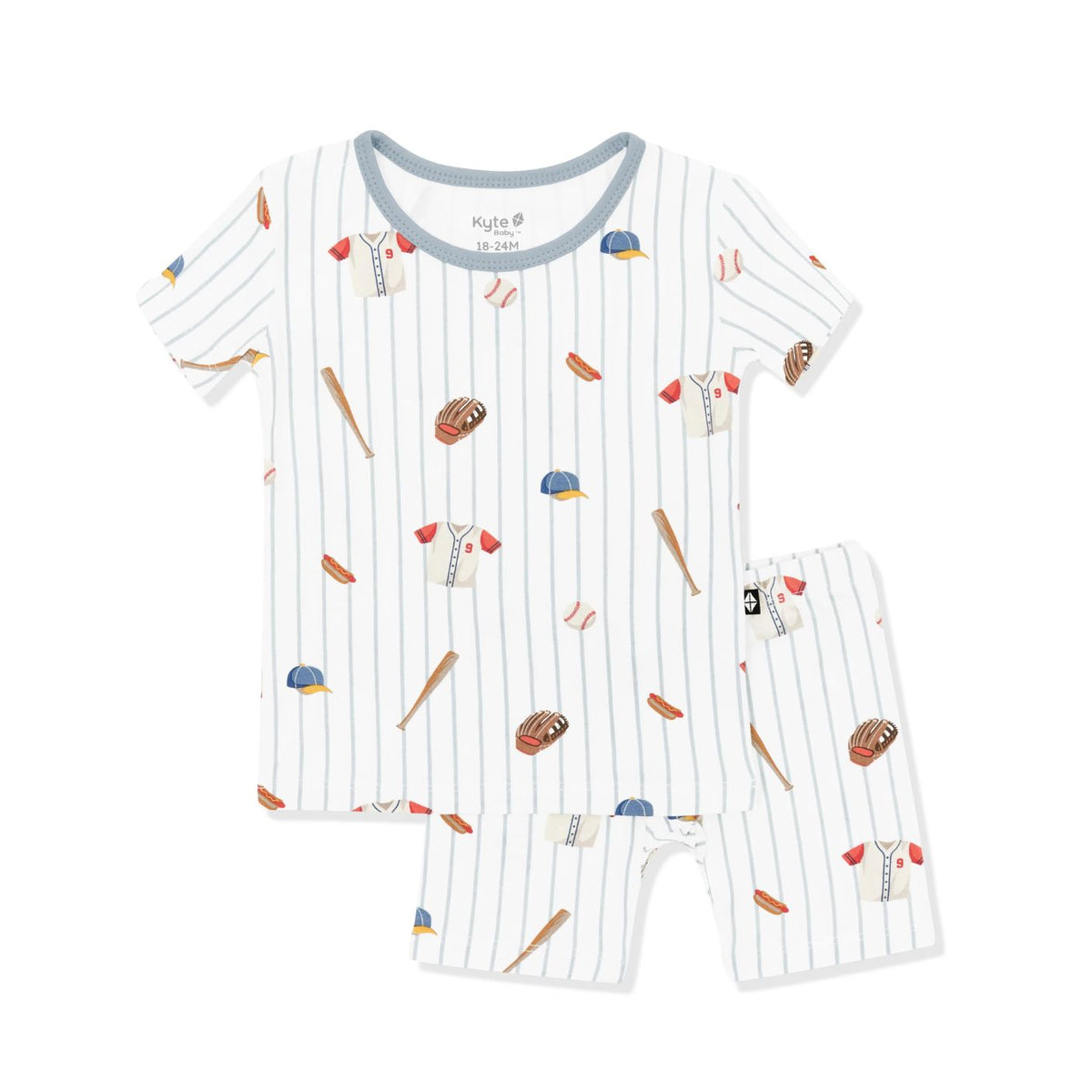 Children's pajama set with sports-themed design on a white background