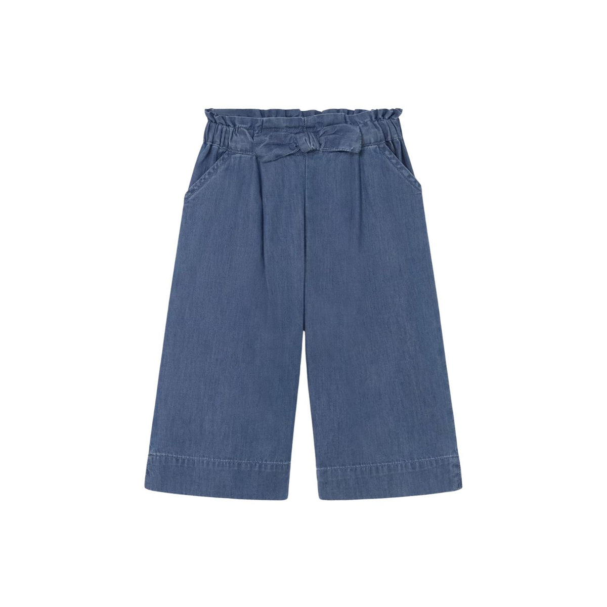 A pair of wide-leg denim shorts in a medium blue wash, featuring an elastic waistband and pleated front details, shown against a plain white background.