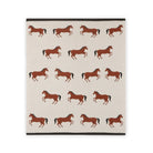 Beige blanket with brown horse pattern on a white background
