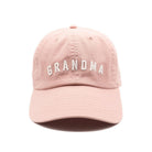 Pink cap with 'GRANDMA' text on a white background