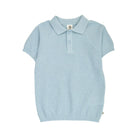 A light blue short-sleeve knit polo shirt with a textured waffle pattern, featuring a two-button placket and a small circular brand tag on the collar.