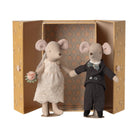 A couple of plush mouse figurines posed in front of an open decorative gift box. The female mouse wears an ivory wedding dress and veil and holds a small pink flower.