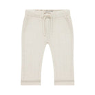 Beige baby pants with a drawstring on a white background