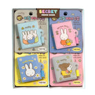 Set of cartoon-themed memo books with colorful designs and characters in packaging.