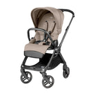 Beige and black stroller on a white background