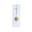 Gold candle with 'Tops' branding on a white background