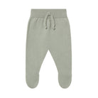 Green baby pants with a drawstring on a white background