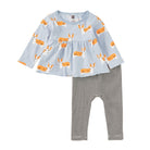 A toddler girl's two-piece outfit featuring a light blue long-sleeve top with an orange and white corgi print, paired with black and white horizontally striped leggings, shown on a plain white background.
