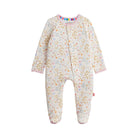 A baby footed sleeper in a cream-colored fabric with a delicate multicolor floral and leaf pattern, featuring pink trim and a colorful striped inner collar.