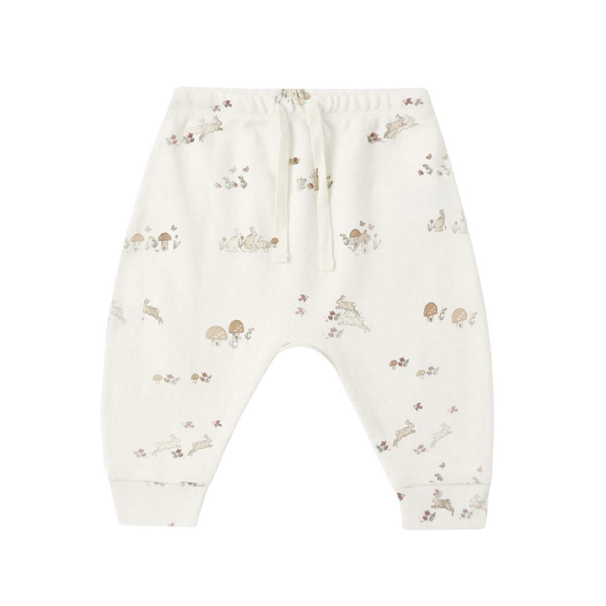 White baby jogger pants with a small brown and beige animal and mushroom print, featuring an elastic waistband and drawstring.