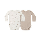 Two long-sleeve baby bodysuits laid flat on a white background. The left bodysuit is off-white with small scattered brown and beige animal prints.