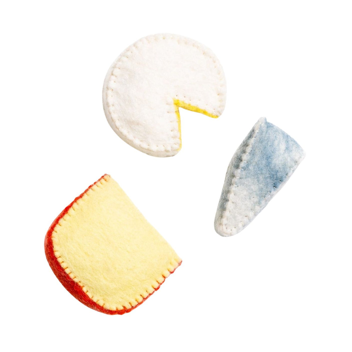 Three felt game pieces on a white background: a white round piece with a yellow wedge missing, a pale yellow semi-circle with a red border, and a blue-gray pointed piece.