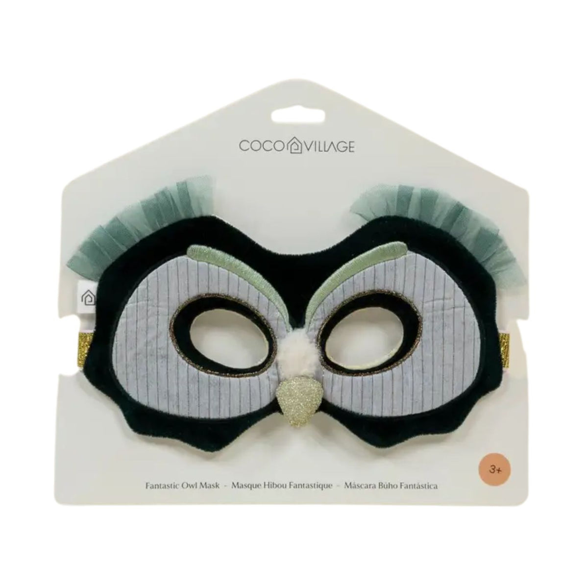 Coco Village owl costume mask in its original packaging, featuring a black and white pinstripe design with mint green tulle ear flaps and a glittery gold beak.