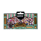 Omy French Baguette Stickers in a decorative cardboard packaging with a black hanging tab, featuring colorful baguette illustrations and a pink and green striped border.
