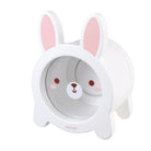 A white bunny-shaped hair dryer cover with pink inner ears, a cute bunny face on the front, and the brand name 'Janod' printed near the bottom.