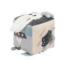 A cube-shaped plush toy with a patchwork design featuring a white octopus on top, a gray and blue face on the front, and a gray turtle on the side, set against a plain white background.
