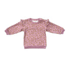 A children's long-sleeve sweatshirt in dusty pink with an allover leopard print pattern in brown and beige, featuring ruffle details on the shoulders and ribbed cuffs, collar, and hem.