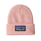 A light pink ribbed knit beanie hat featuring the signature Patagonia mountain logo patch on the front cuff.