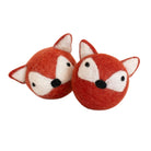 Two small felt fox toys in reddish orange and white, shown on a plain white background.