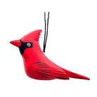 A carved wooden cardinal Christmas ornament in vibrant red with black accents on the beak, eye area, and tail feathers, complete with a black hanging string, shown against a plain white background.