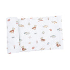 A folded white muslin blanket with a cute duck and fish pattern, displayed on a clean white background.
