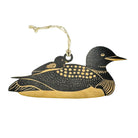 A decorative loon-shaped ornament with a black and gold finish, featuring a small bird perched on its back and a hanging loop at the top, shown against a plain white background.