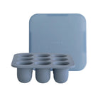 Blue silicone ice cube tray with lid on a white background
