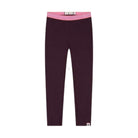 A pair of dark plum-colored leggings with a contrasting pink patterned waistband, shown flat against a solid white background.