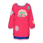 A bright pink fuzzy long-sleeve sweater with a rainbow and flower applique design, featuring blue and pink ribbed trim at the collar, cuffs, and hem.