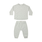 A two-piece baby clothing set consisting of a long-sleeve top and matching pants in a light sage green heather fabric, both featuring a small white dog print all over. The set is displayed flat against a solid white background.