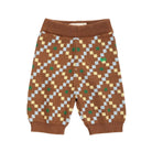 A pair of baby knit pants in brown with a geometric diamond pattern in light blue, pale yellow, and green, featuring ribbed waistband and leg cuffs.