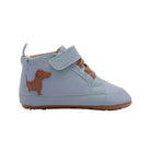 A light blue leather baby high-top sneaker with a brown dog-shaped patch on the side, a hook-and-loop strap, and a brown outsole, shown against a plain white background.