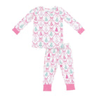 A two-piece children's pajama set featuring a long-sleeve top and matching pants with a white background, pink trellis and bow pattern, and light green pine tree motifs. The cuffs and ankles are solid pink.