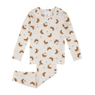 A long-sleeve crewneck top by Firstst, featuring an all-over print of brown croissants and small green pine sprigs on a light cream background.