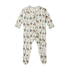A baby footed sleeper with long sleeves and an all-over woodland print of deer, trees, and pine trees on a cream background. The sleeper has a light sage green trim at the collar and cuffs, and a snap-button front closure.