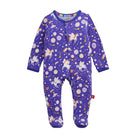 A baby footed sleeper in purple with a whimsical unicorn and space print, featuring white long sleeves and legs, a snap closure at the neck, and a small red tag on the side.