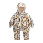 A baby hooded one-piece snowsuit with an all-over tiger stripe pattern in black, brown, and cream, featuring a white zipper and white lining.