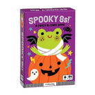The box of 'Spooky 8s! A Crazy 8s Card Game' by Mudpuppy, featuring a purple background with a green frog on an orange pumpkin, set against a plain white background.