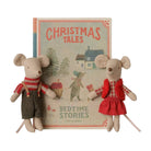 A children's book titled 'Christmas Tales: Bedtime Stories' by Maileg, displayed upright with two plush mouse characters in holiday clothing in front of it, on a plain white background.