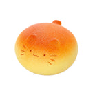 A novelty squishy toy shaped like a bun with cat face on a white background.
