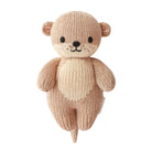 Knitted teddy bear toy on a white background