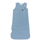 Blue sleeveless dress with a white label on a white background
