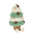 A plush cupcake-shaped toy or decorative figure with fluffy white and mint green frosting-like layers, with eyes and mouth, brown acorn ornaments, and a brown corduroy-like base on a white background.