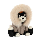 A plush dog toy wearing a beige parka with a large cream faux-fur hood and black-and-white paws and face, photographed on a plain white background.