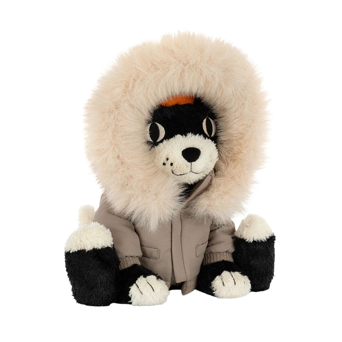 A plush dog toy wearing a beige parka with a large cream faux-fur hood and black-and-white paws and face, photographed on a plain white background.