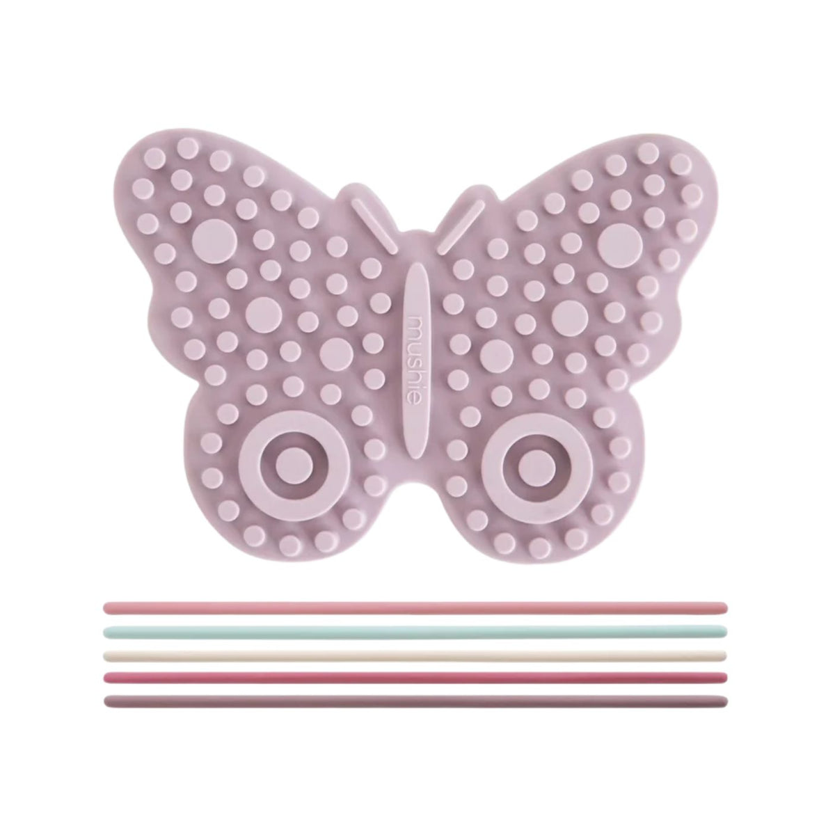 A butterfly-shaped silicone baby teether or massage toy in a dusty lavender-purple color, featuring raised circular dots and two circular eye-like patterns. Below the butterfly are five thin silicone sticks in pastel pink, mint green, cream, dusty rose, and mauve.